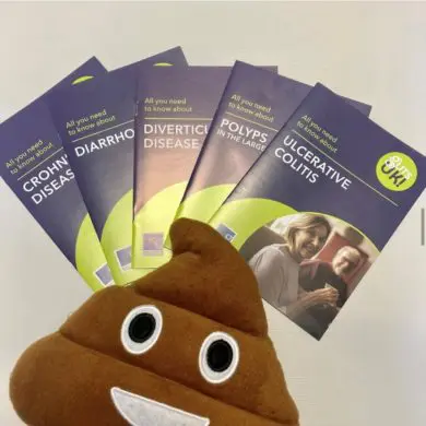 Five of Guts UK leaflets are fanned out on top of each other including Crohn's disease, diarrhoea, diverticular disease, polyps and ulcerative colitis. The poo emoji cushion is sat on top of them.