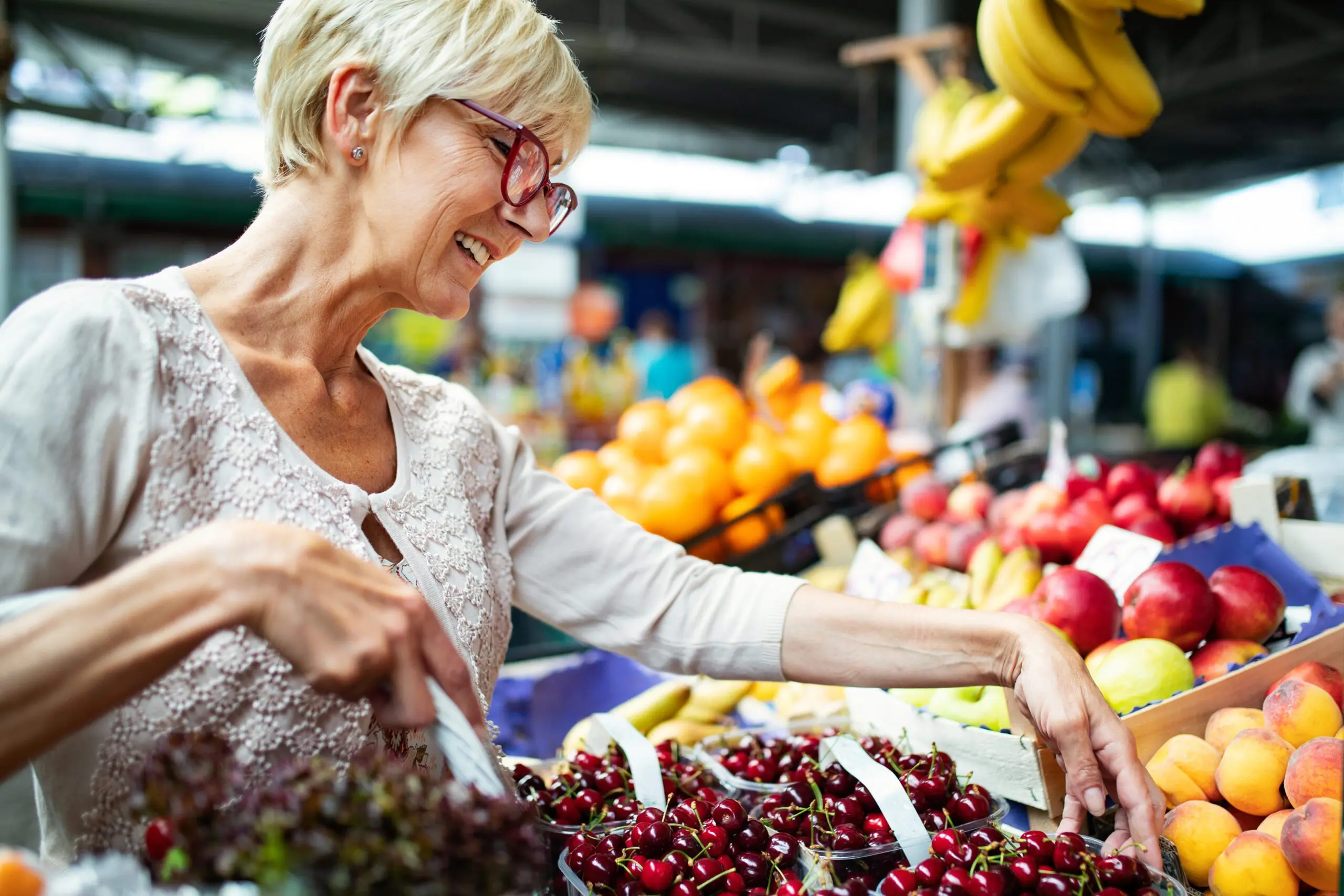 Lady with flasses on shopping at a local fruit market