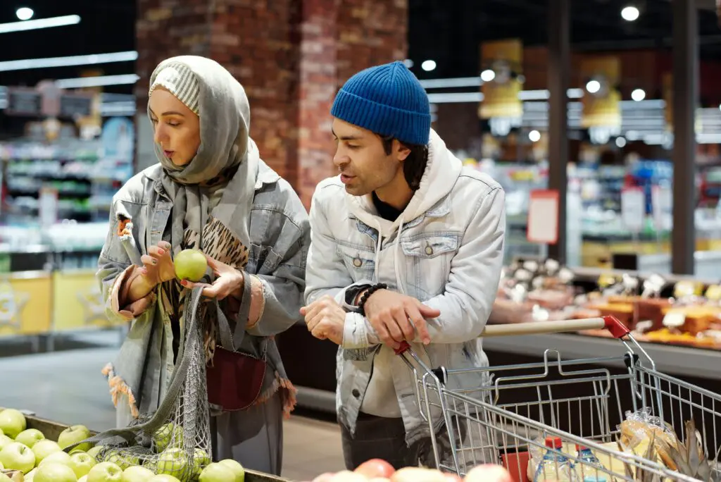 Couple buying apples