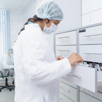 Medical Professional looking at Archives in a Drawer