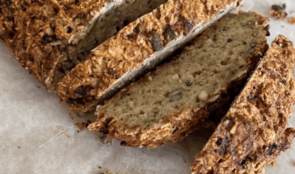 A picture of a partly sliced loaf of bread
