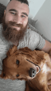 Sean pictured with his dog, a golden Labrador called Mikey.